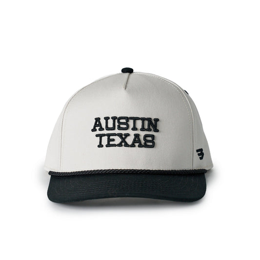 White and black cap with 'Austin Texas' text on a white background