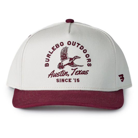 Cap with 'Burlesco Outdoors Austin, Texas Since '15' text and logo on a white background