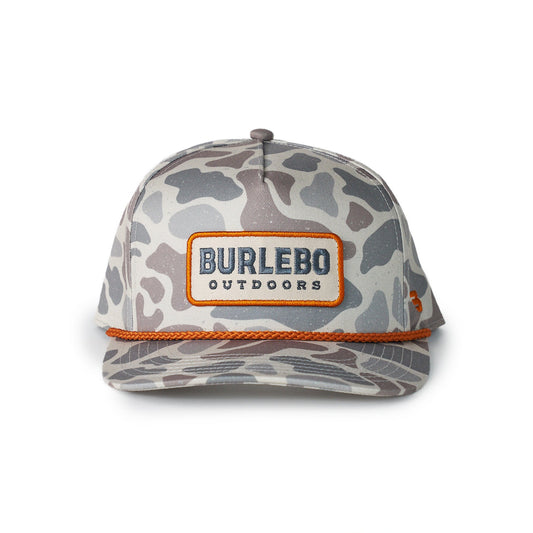 Camouflage-patterned cap with 'Burlebo Outdoors' logo on a white background