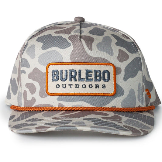 Camouflage-patterned cap with 'Burlebo Outdoors' logo on a white background