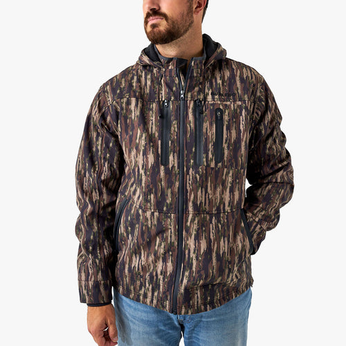 Man wearing a camouflage jacket on a white background