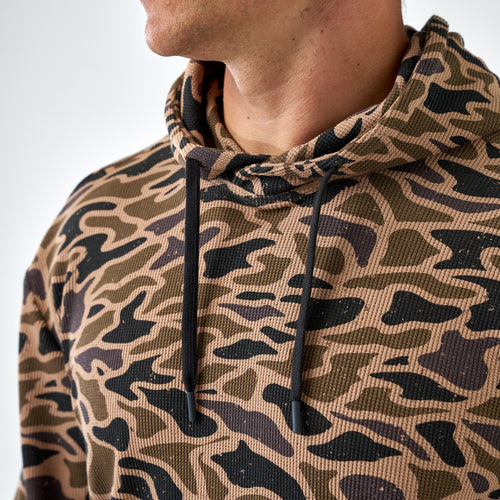 Close-up of the Gauge Camo Thermal Hoodie hood and black drawstrings