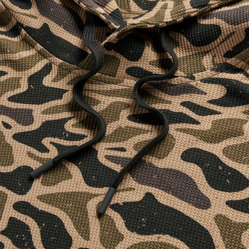 Detail of the Gauge Camo Thermal Hoodie black drawstrings on the waffle knit camo