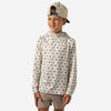 Boy wearing the Mallard Duck Dog Youth Performance Hoodie, cream with a dog and duck print, front view