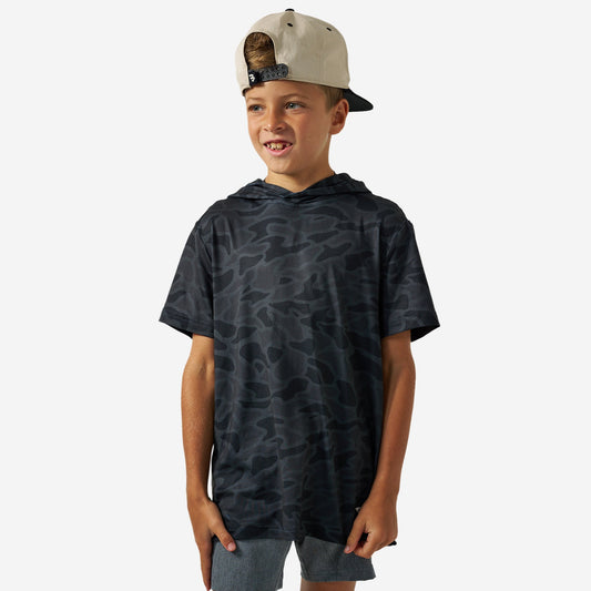 Boy wearing the Black Camo Youth Short Sleeve Performance Hoodie with a backwards cap, front view